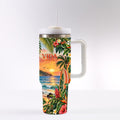 A stainless steel tumbler with a tropical beach scene printed on it, featuring palm trees, flowers, and a sunset over the ocean.