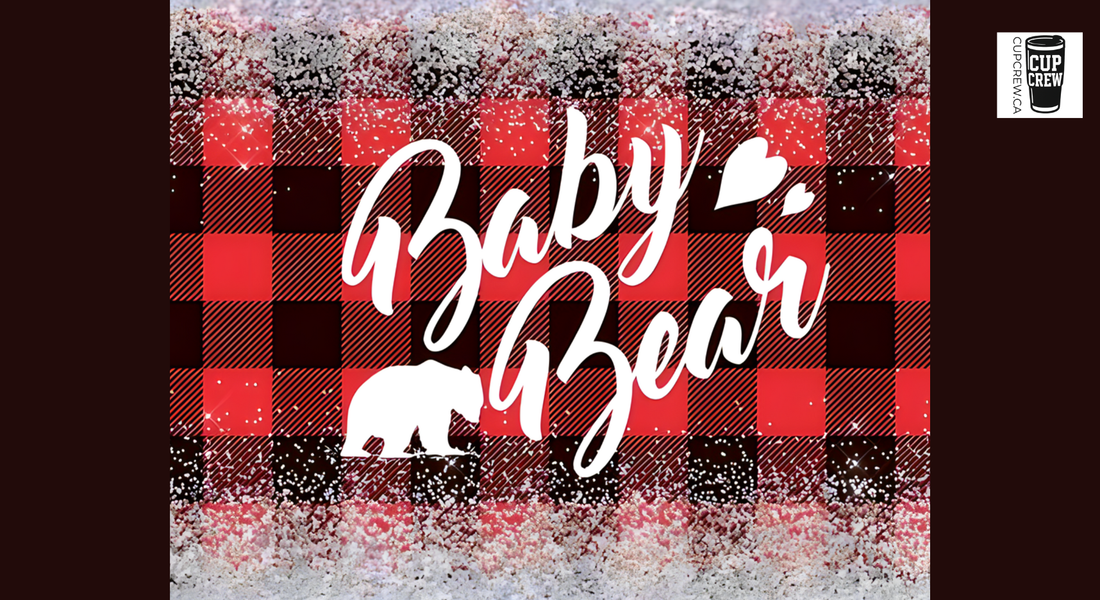 a graphic design with a red and black plaid background and the text "Baby Bear" written in a stylized font.